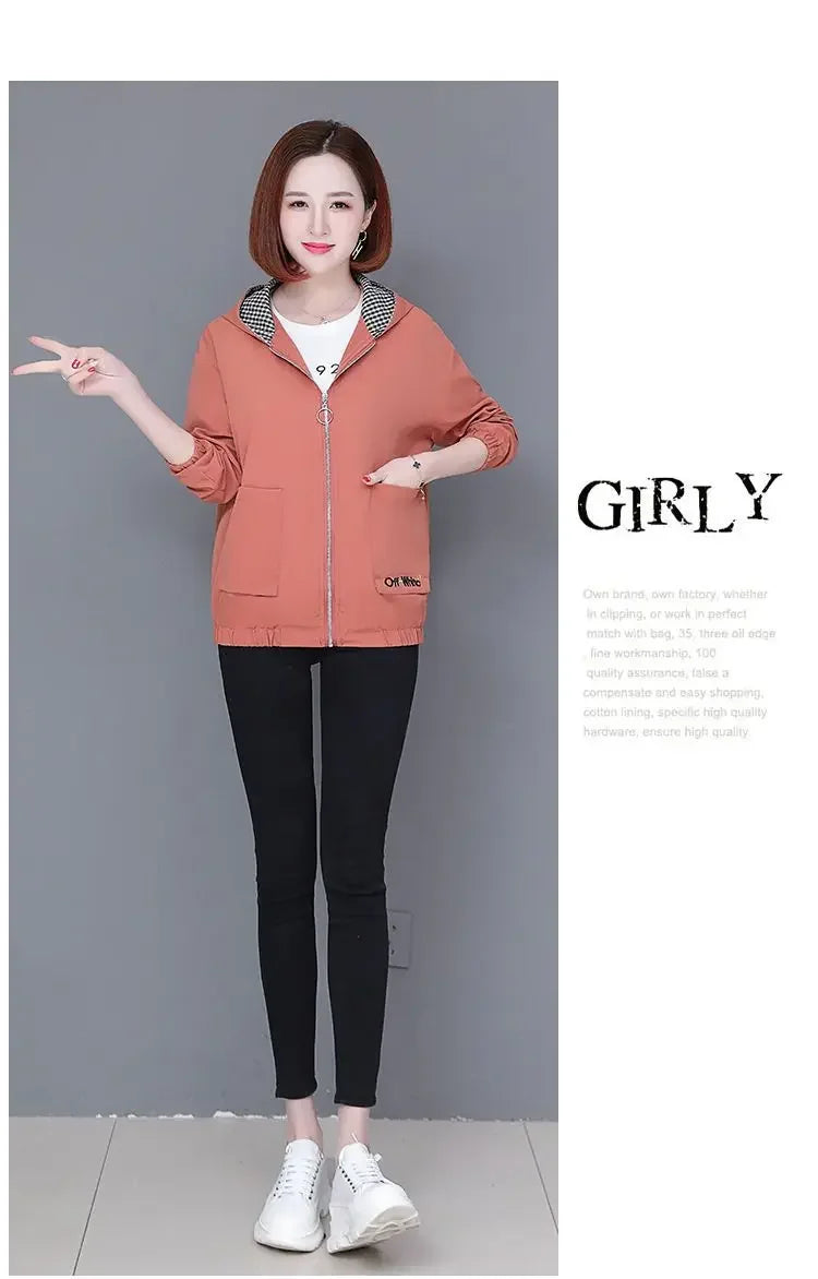 Woman wearing a casual, zip-up dusty pink hooded jacket with a checkered inner lining and two front pockets.