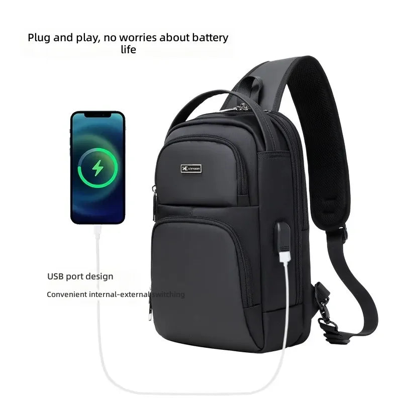 Black waterproof sling bag with an integrated USB charging port for mobile devices and a secure zip design.