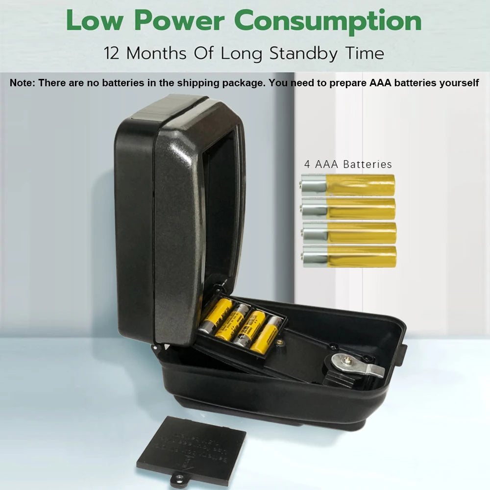 Open black plastic key lock box showing an internal battery compartment that requires four AAA batteries.