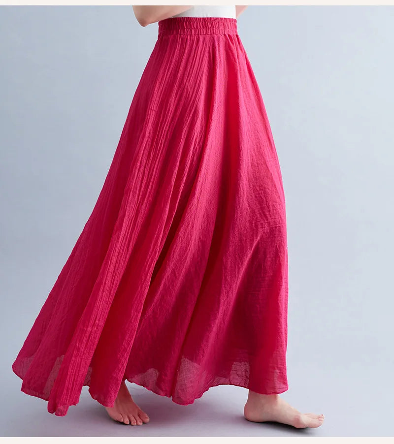 Bright pink, A-line maxi skirt with an elasticated waistband and lightweight, textured fabric.