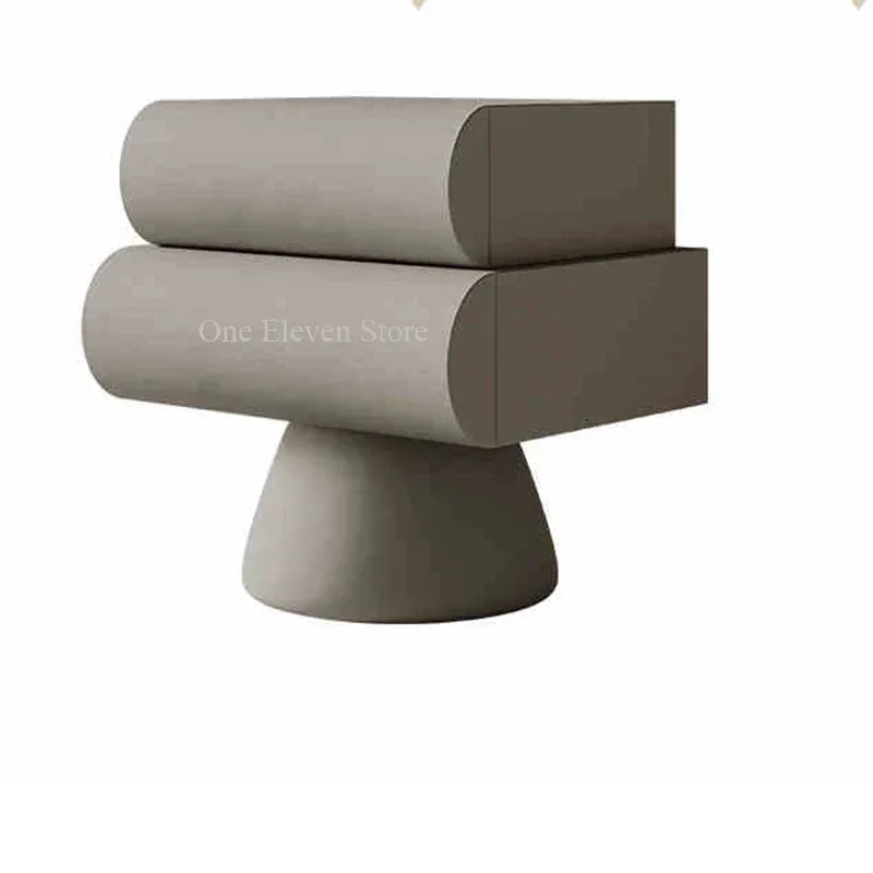 Modern grey floating bedside table with two curved drawers and a pedestal base.