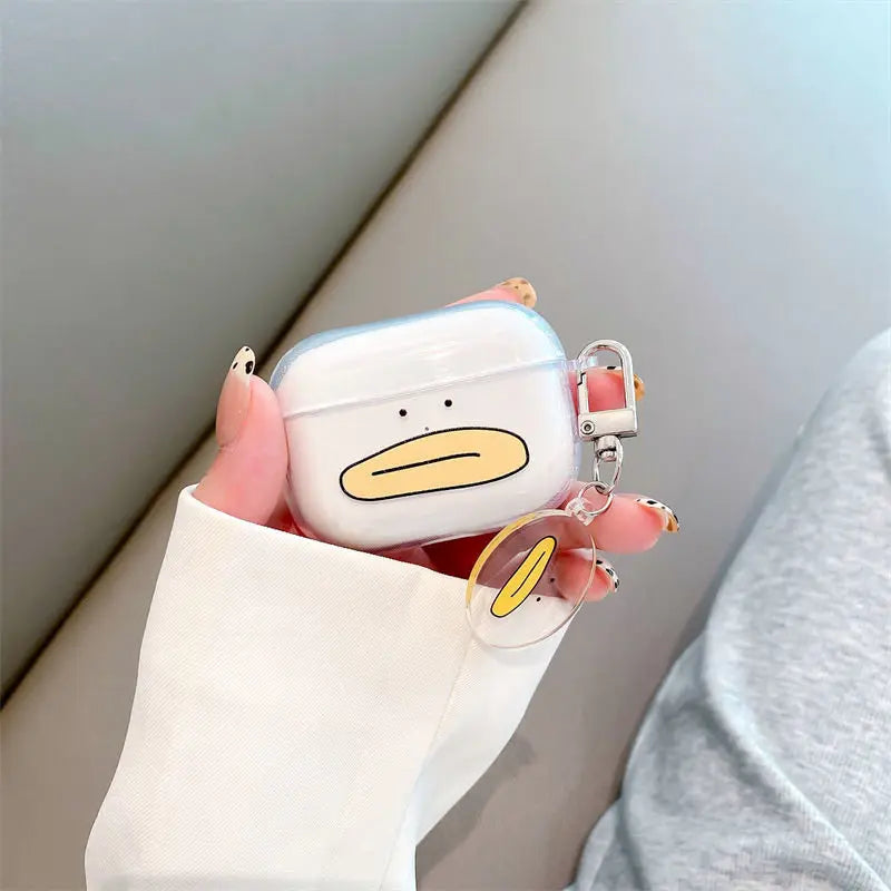 Clear TPU AirPods Pro case with a duck face print and matching charm, held in a hand.