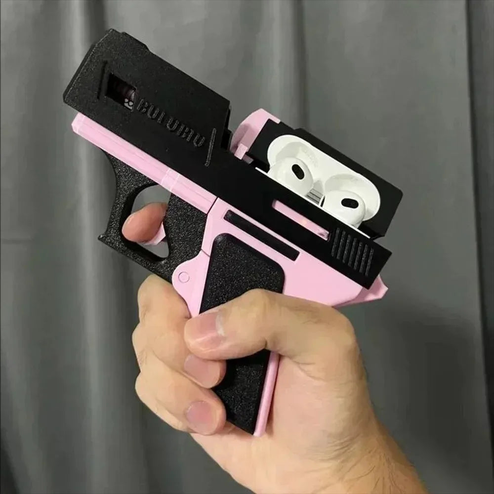 Black and pink textured gun-style AirPods case for Apple AirPods (3rd Gen), held in a hand.