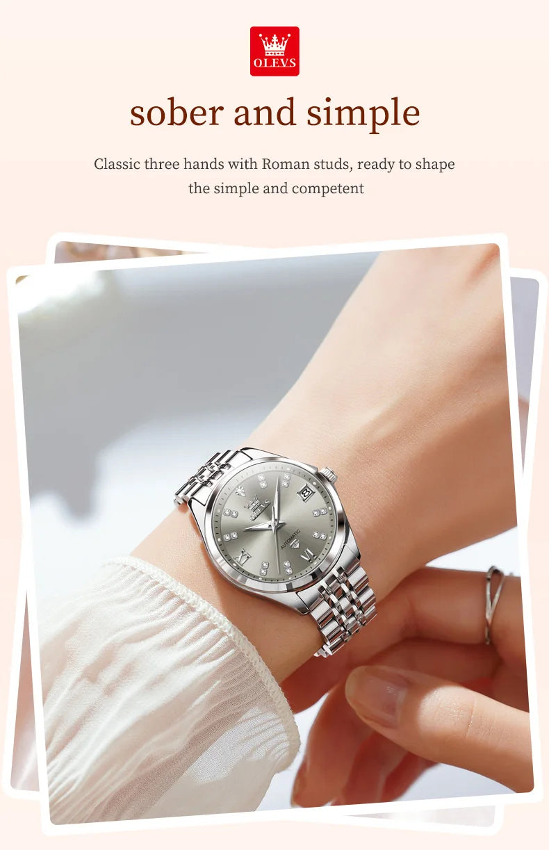 Elegant women’s silver stainless steel automatic watch with a grey dial, crystal markers and a date window.