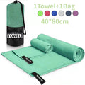 Mint green microfibre quick-dry towel set with a matching drawstring carry bag, shown unfolded and rolled.