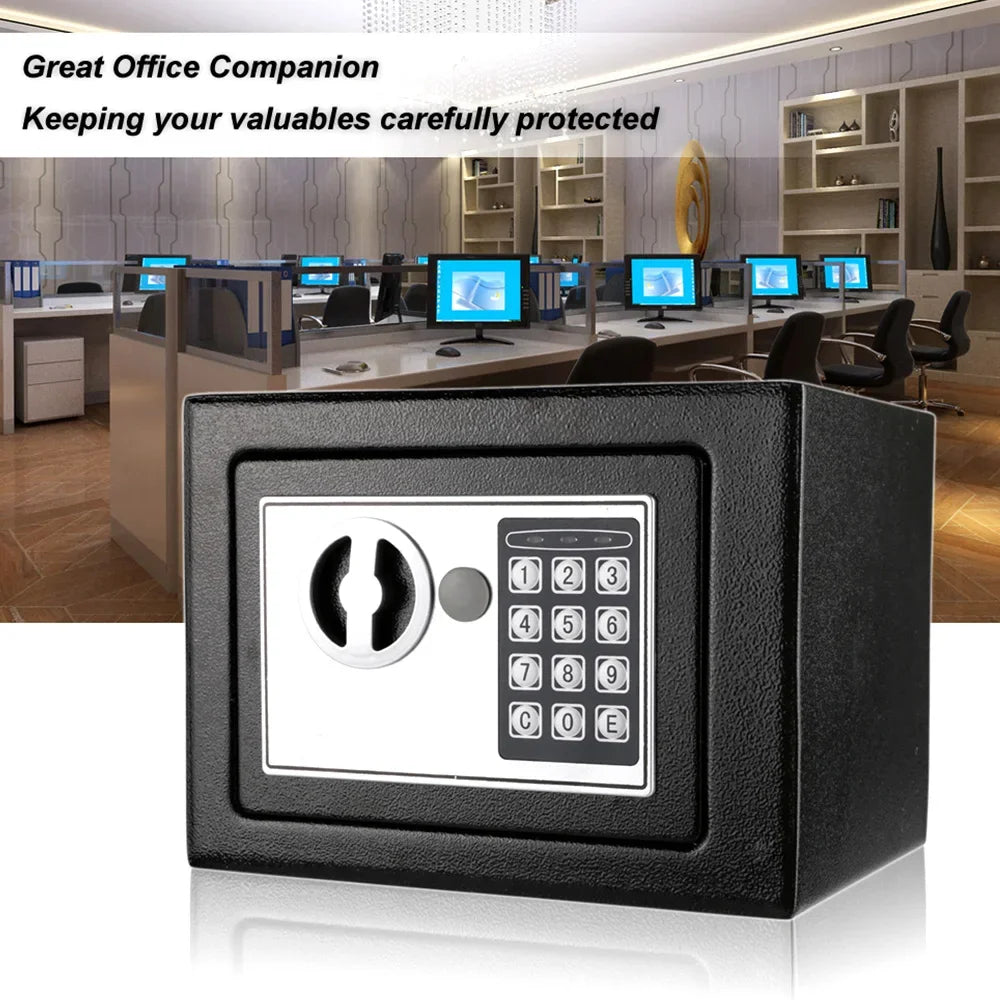 Black metal security safe with a silver electronic keypad and turn-handle lock against an office background.