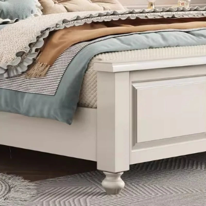 Modern double bed frame in white with a minimalist, clean-lined design and classic turned wooden feet.
