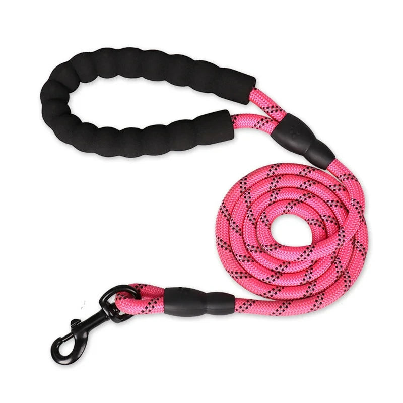 Pink rope dog leash with a black padded handle, reflective detailing, and a durable metal clip.