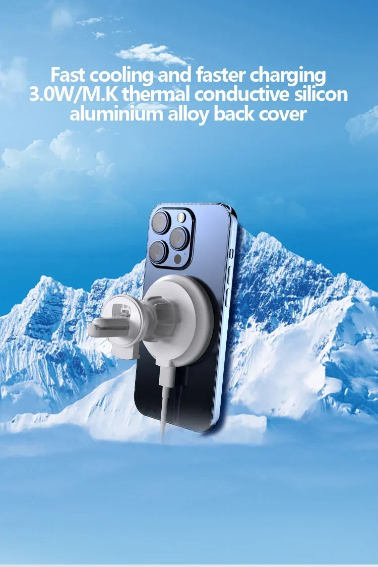 White magnetic phone cooling charger attached to a smartphone against a snowy mountain background.