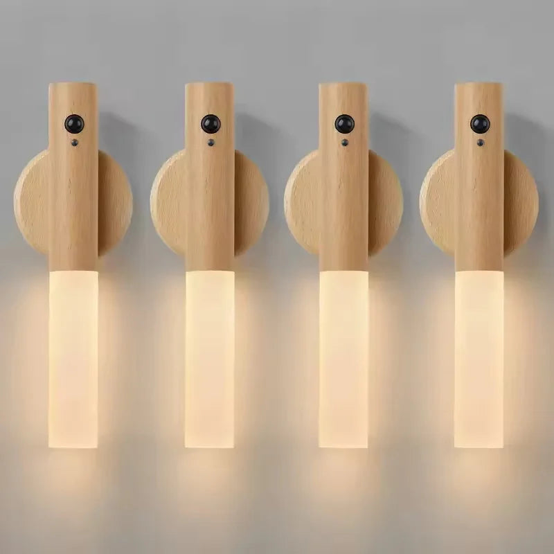 Four minimalist wooden rechargeable LED wall lights with motion sensors and soft, warm white illumination.