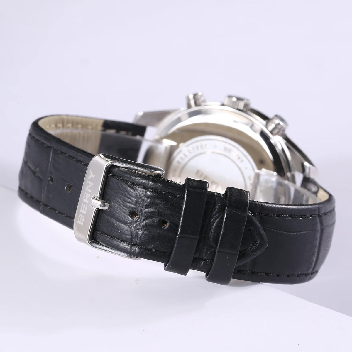 BERNY men's quartz chronograph watch with a textured black leather strap and silver buckle.