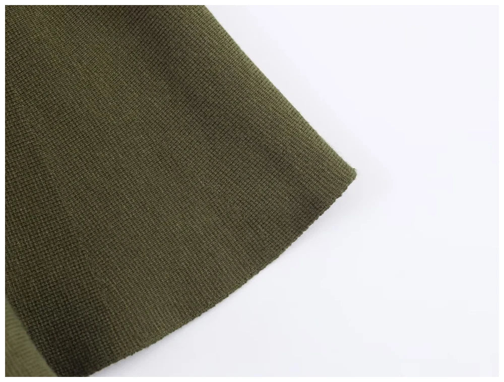 Close-up of olive green finely knitted fabric with a soft, uniform texture.