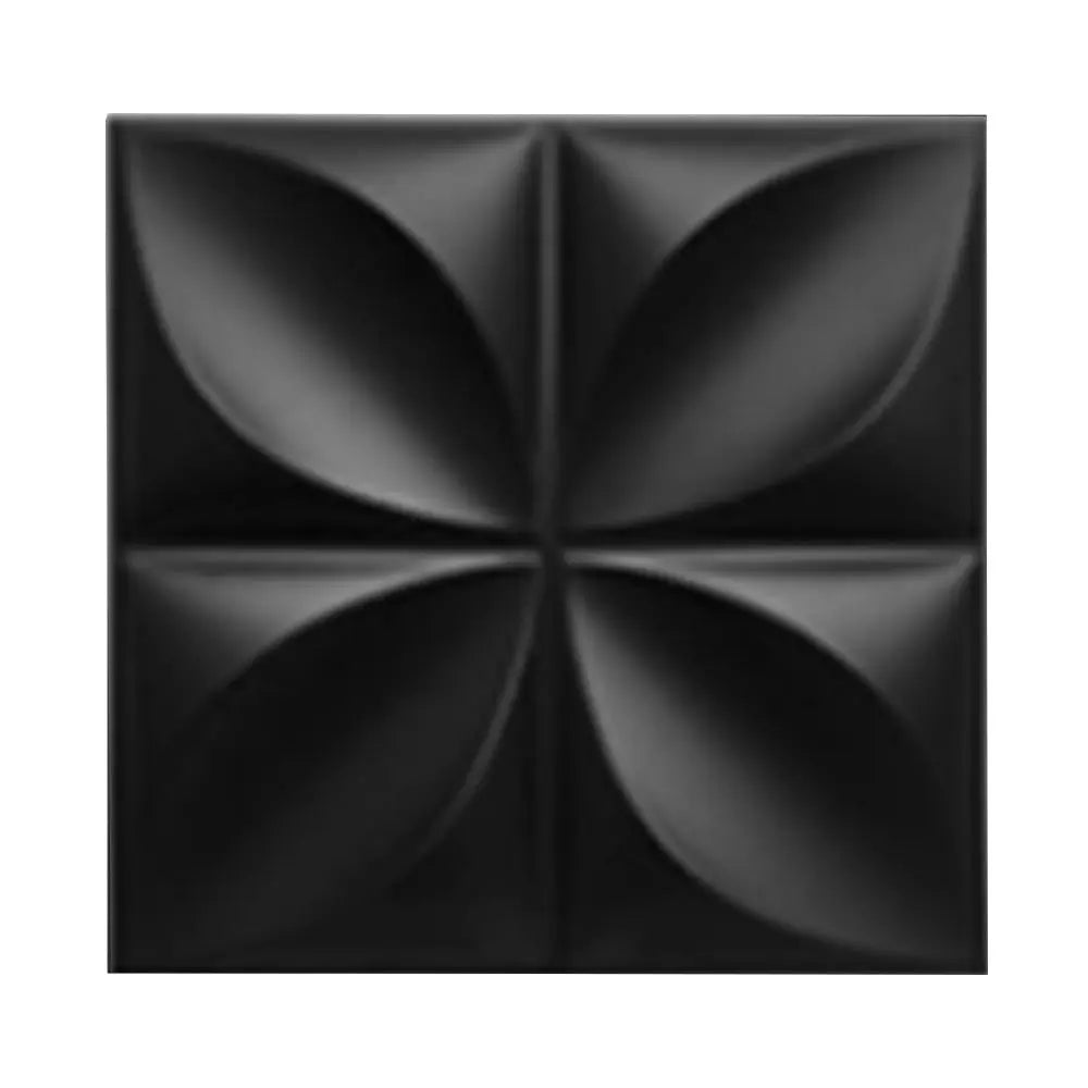 Black square wall tile with a 3D decorative petal or diamond-shaped embossed pattern.