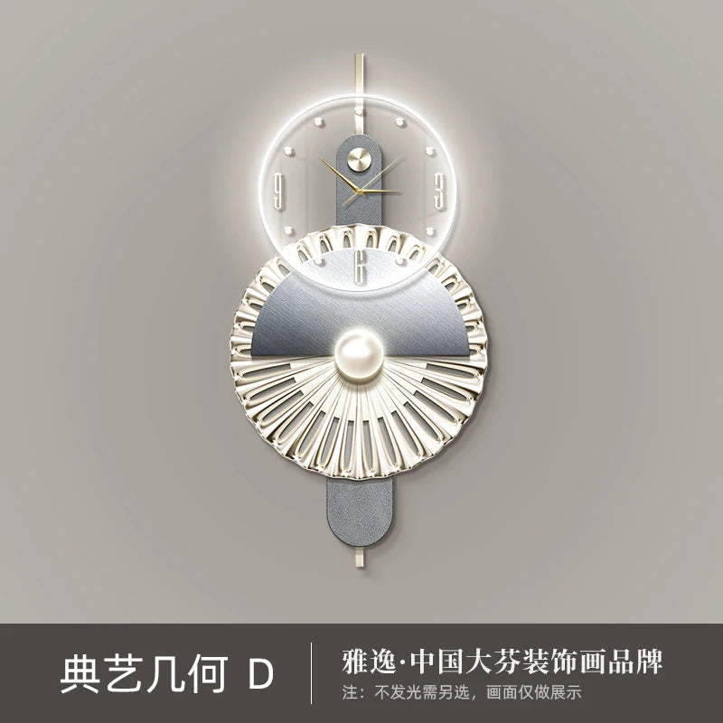 Modern geometric wall clock featuring a backlit circular face, metallic fan-like base, and elegant grey and gold accents.