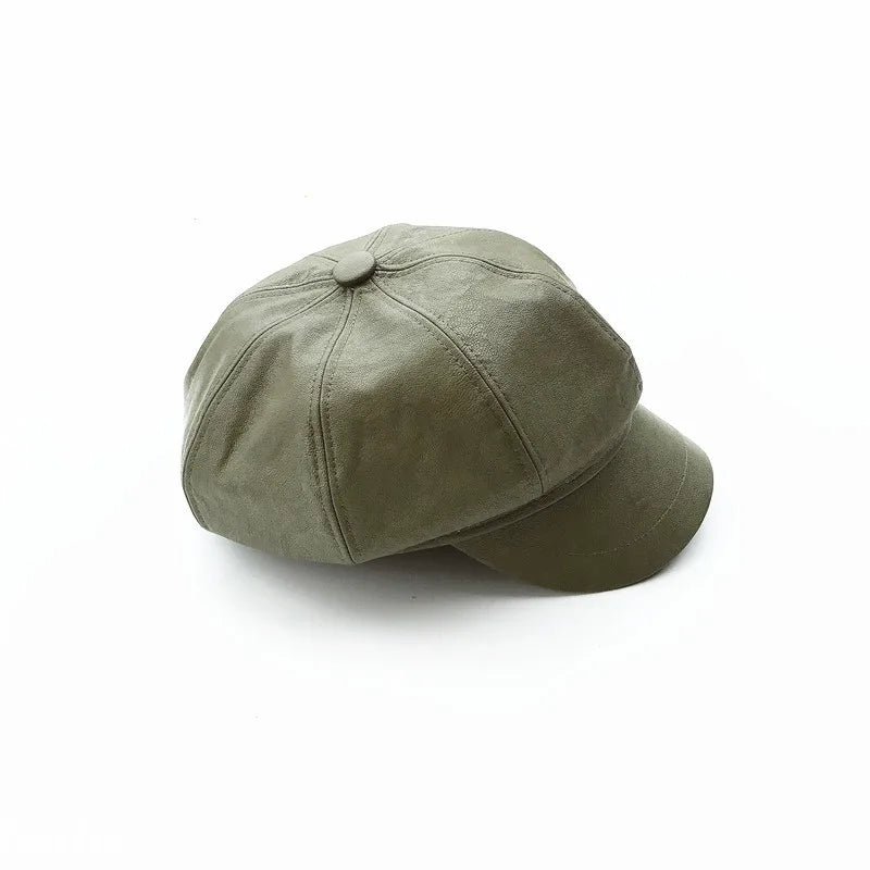 Olive green faux leather baker boy cap with a panelled crown and short curved peak, isolated on a white background.