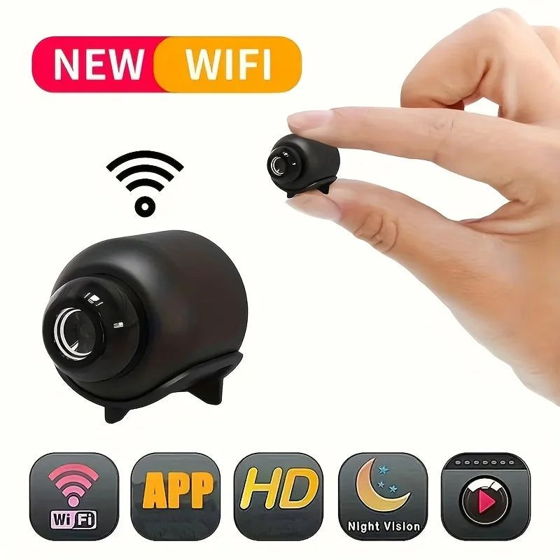 A tiny, black wireless security camera held between fingers, featuring HD recording and night vision capabilities.