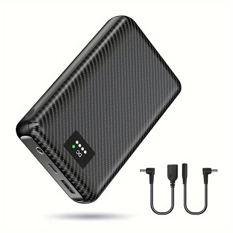 Black carbon-fibre style 40000mAh power bank for heated clothing, featuring LED battery indicator and two cables.
