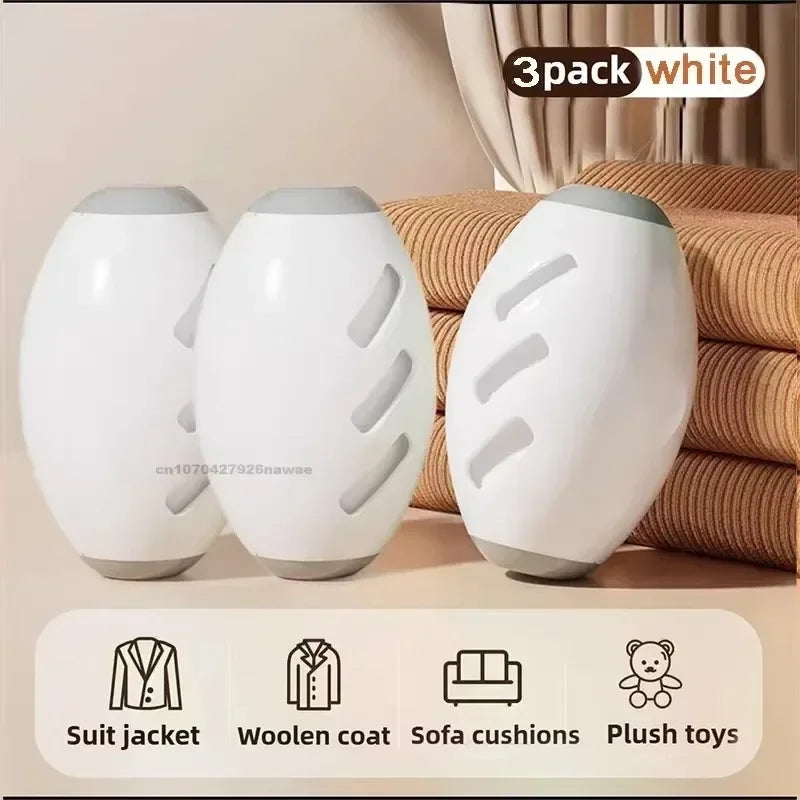 A 3-pack of white, oval-shaped lint removers with grey end caps, shown with icons for fabric and toy care.