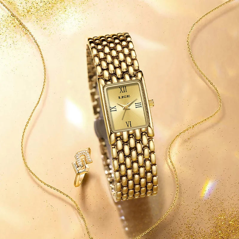 Luxury gold-tone square ladies' watch with a textured link bracelet and Roman numeral dial, displayed with a ring.