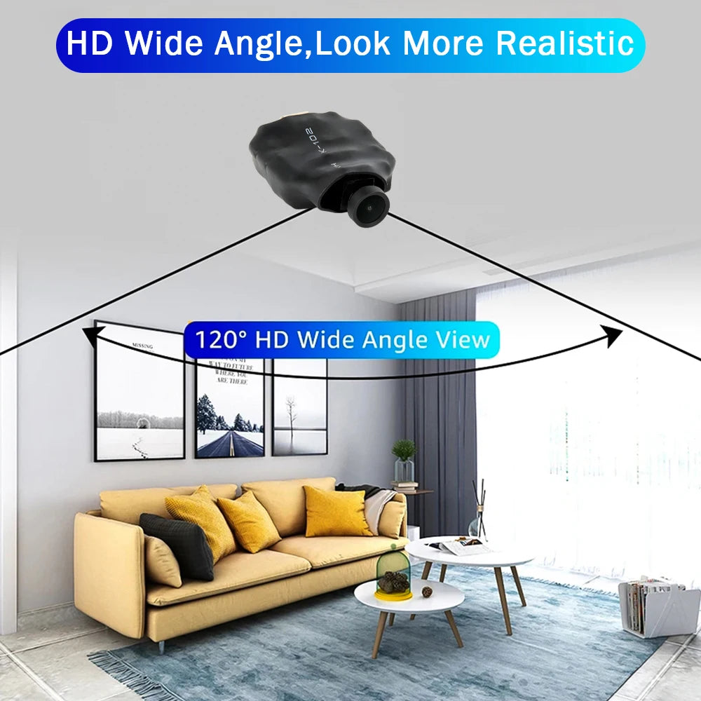 Small black plastic mini security camera with a 120-degree wide-angle lens, shown monitoring a living room.