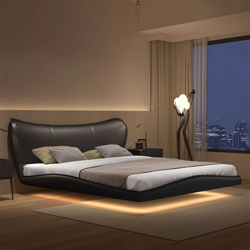 Modern black upholstered bed frame with a sleek, curved silhouette and integrated under-bed lighting.