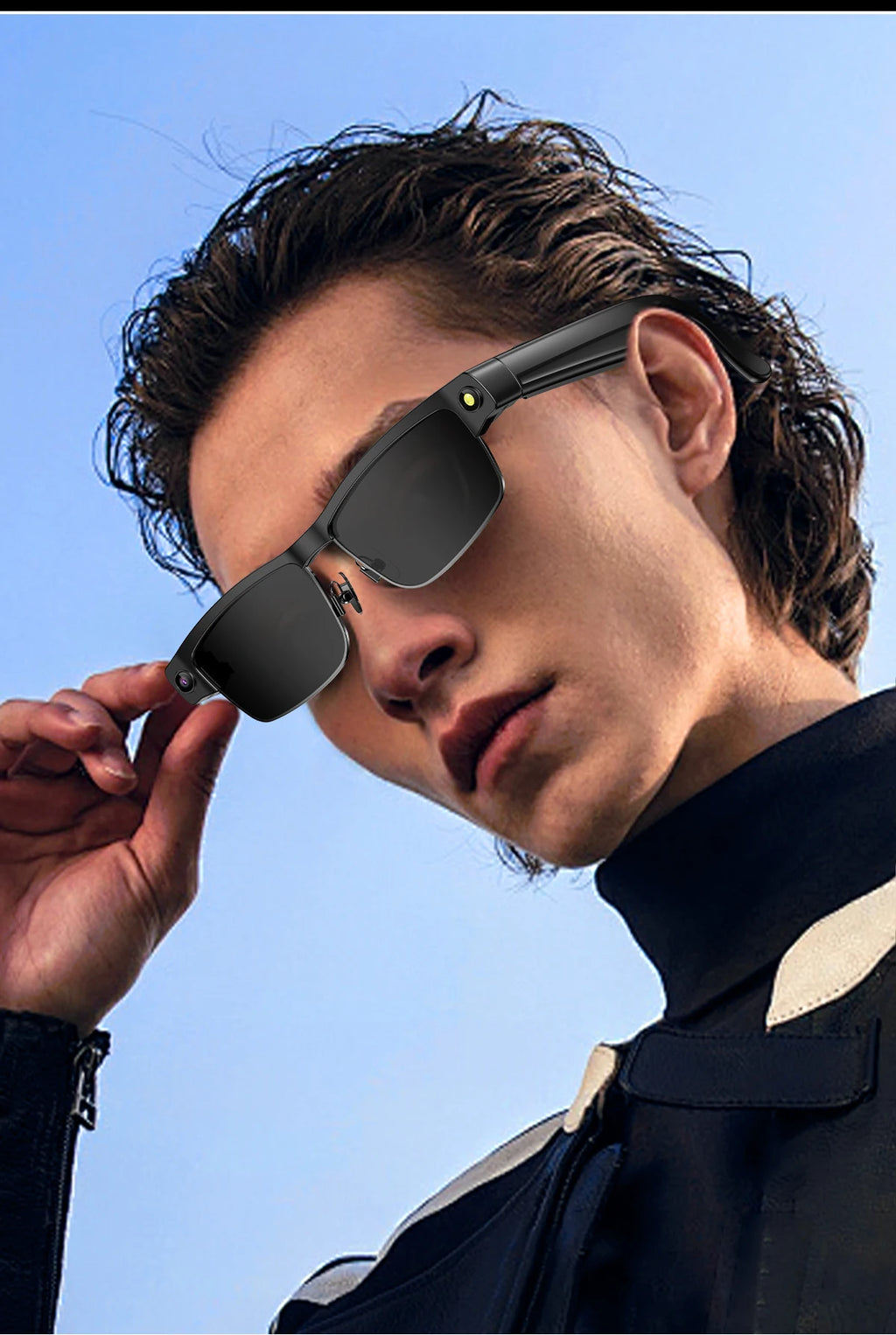 A person wearing sleek black smart glasses featuring an integrated camera and side-mounted LED light.