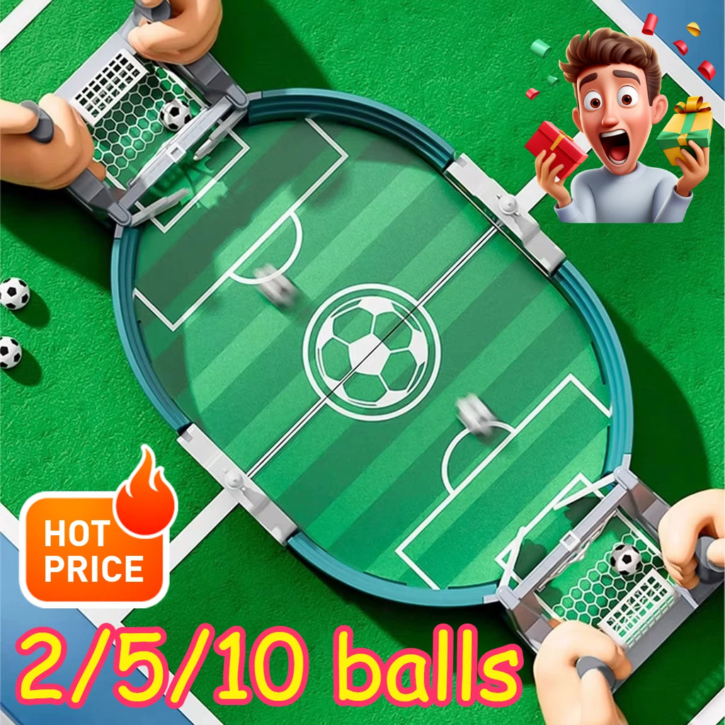 Top-down view of a portable green tabletop football game with grey nets, white pitch markings, and included mini balls.