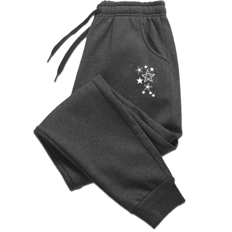 Charcoal grey joggers with an elasticated drawstring waist and a white star print design on the hip.
