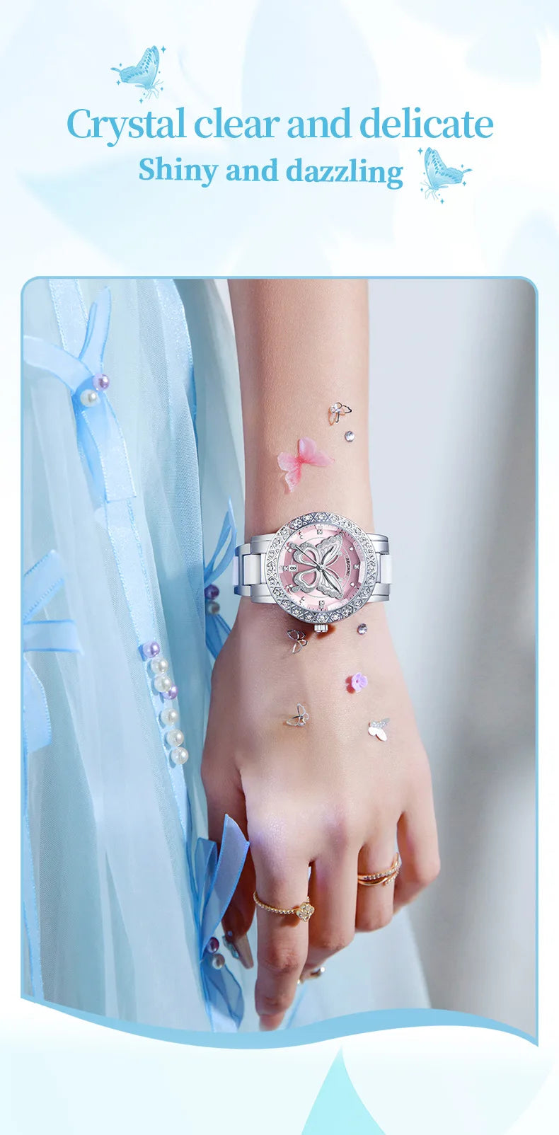 Luxury women’s silver wristwatch featuring a pink butterfly dial, crystal-encrusted bezel, and metallic silver strap.