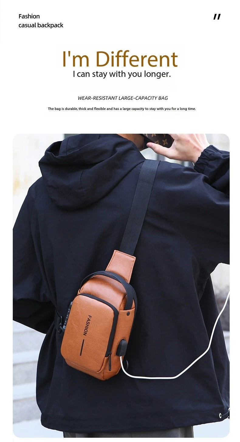 Tan leather-look anti-theft crossbody sling bag with a built-in USB charging port, worn over a black hoodie.