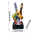 Colourful graffiti-style peace sign hand sculpture on a black square base. Measures approx. 16cm tall.