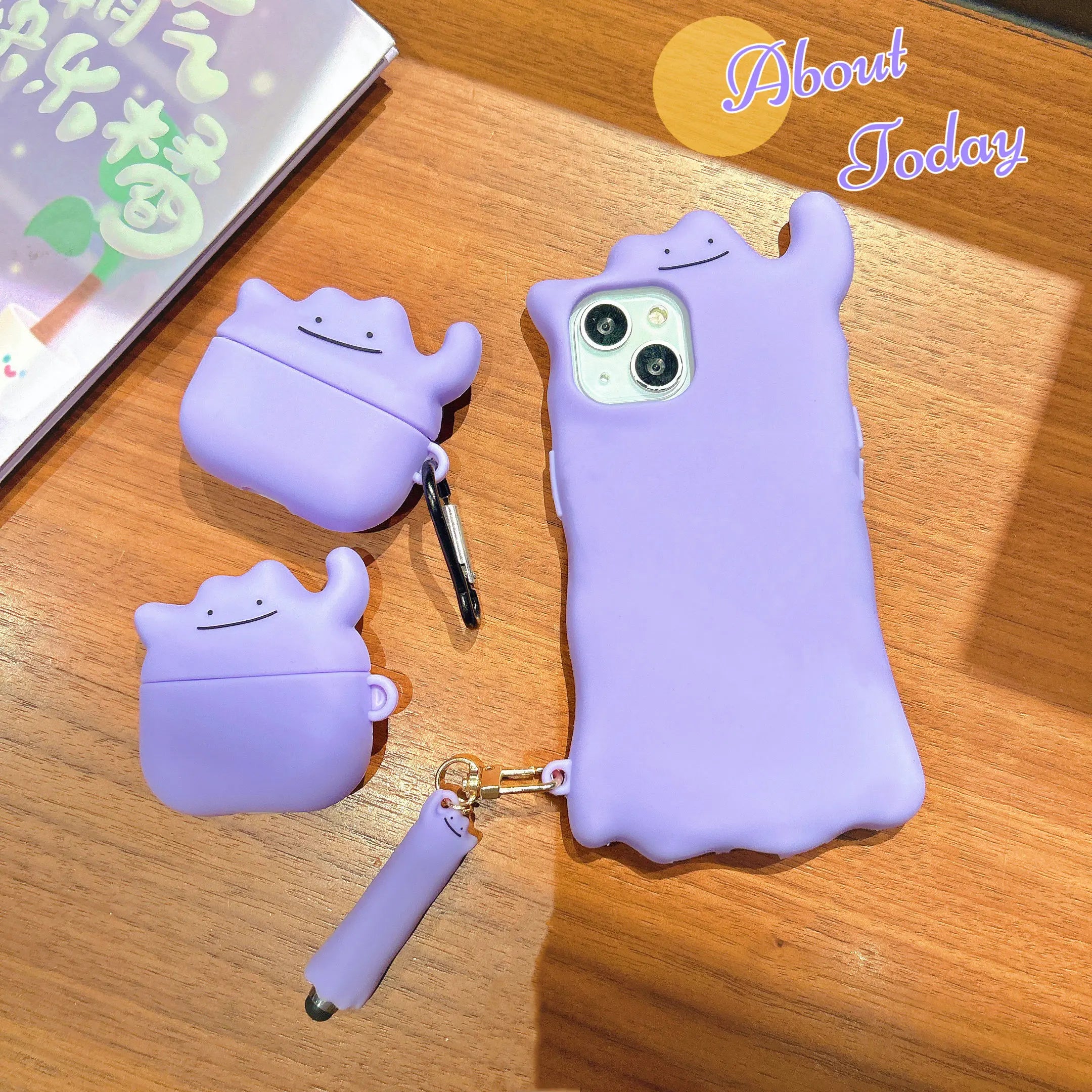 Light purple silicone Ditto-style AirPods Pro and standard cases with matching phone case and stylus.
