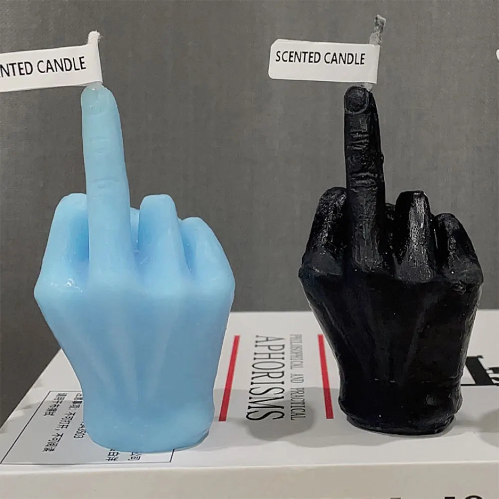 Two novelty hand-shaped scented candles in light blue and black, both making a middle-finger gesture.
