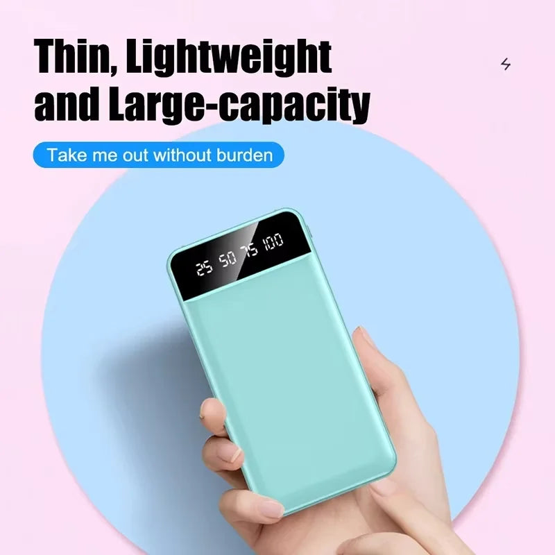 Slim, mint green portable power bank held in a hand, featuring a clear LED digital battery level display.