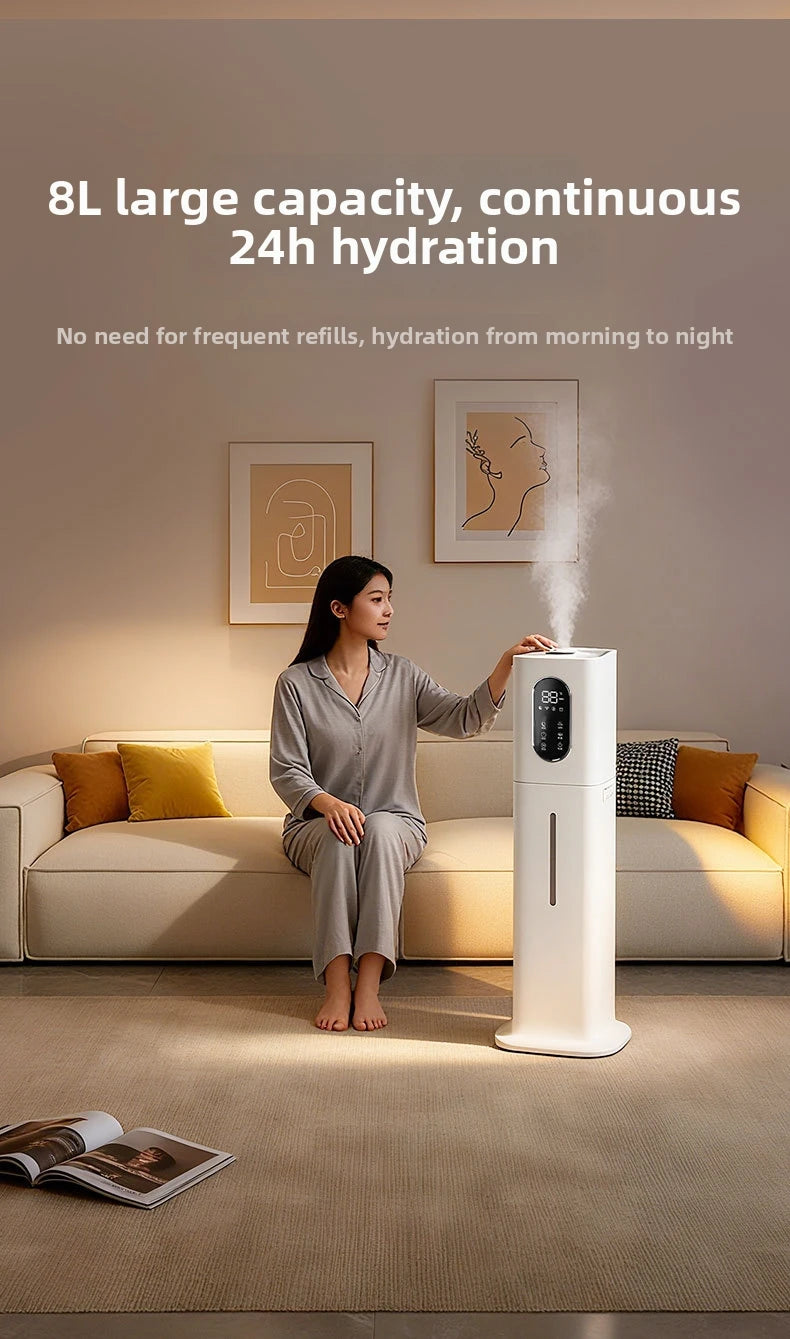 White 8L floor-standing ultrasonic humidifier with digital display and mist output in a modern, cosy living room.
