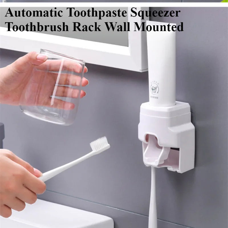 White wall-mounted automatic toothpaste squeezer and toothbrush holder in a modern bathroom setting.