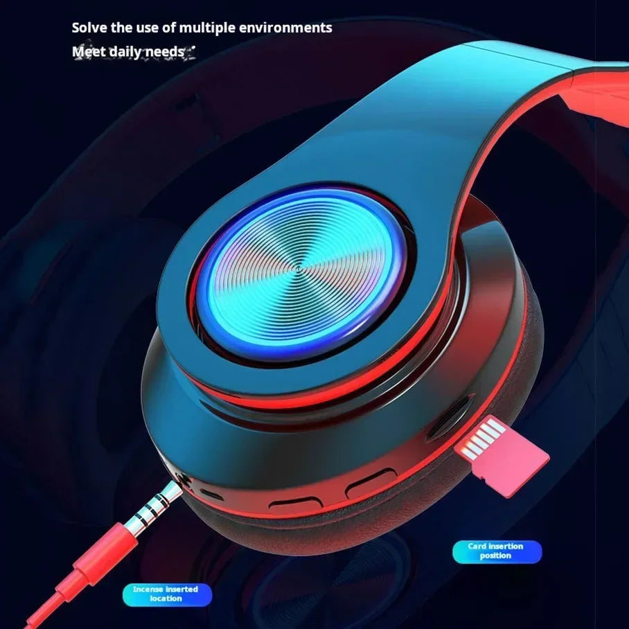 Wireless gaming headset in black and red with blue LED ear-cup lighting, including aux and memory card ports.