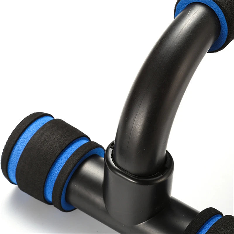 Black plastic push-up stand with blue and black foam-padded hand grips, set against a white background.