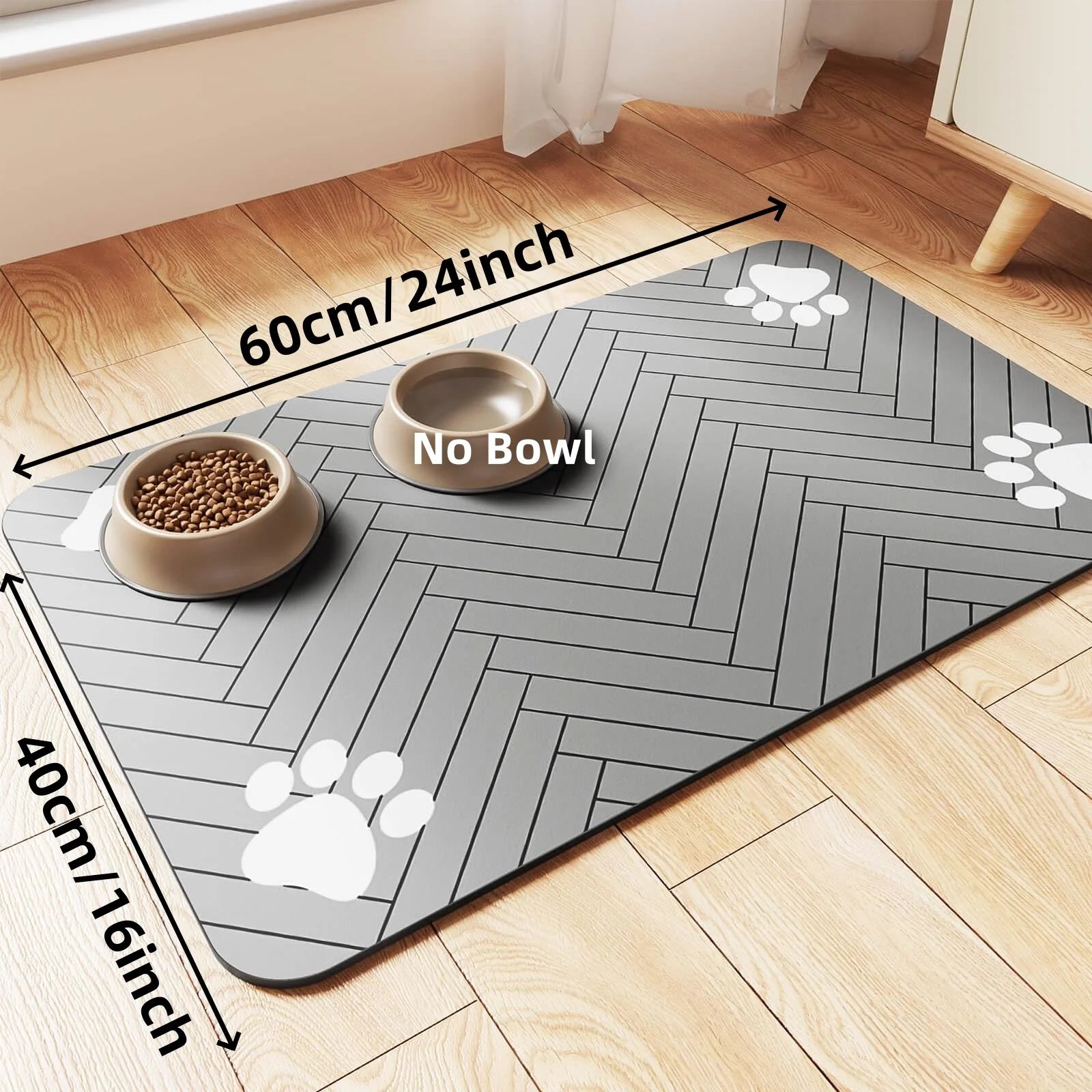 Grey pet feeding mat with a herringbone pattern and white paw print accents. Size is 60cm by 40cm. Bowls not included.