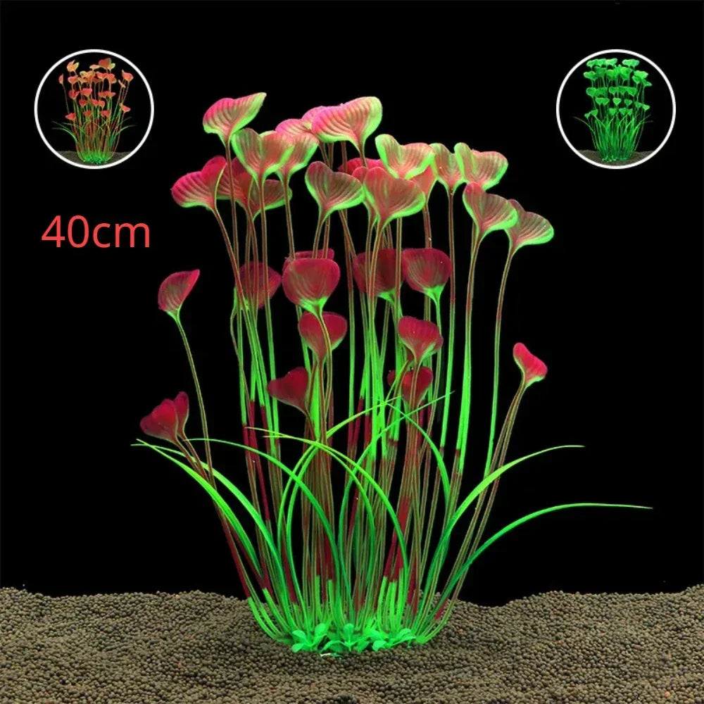 Artificial 40cm aquarium plant with tall stems, green grassy base, and heart-shaped pink and green leaves on black.