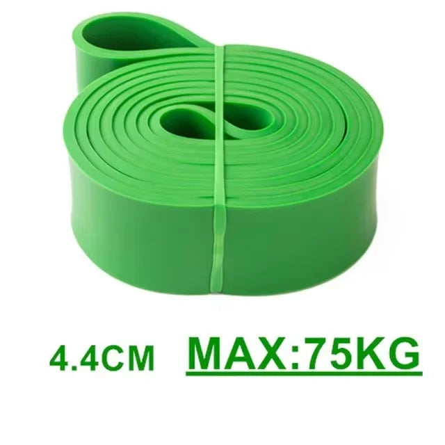 A green exercise resistance band coiled and held together, with text reading "4.4cm" and "Max: 75kg".