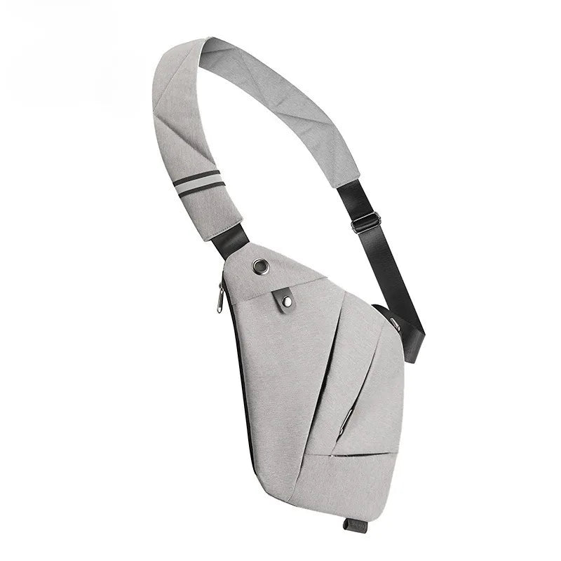 Light grey slimline waterproof crossbody bag with an adjustable strap, multiple zip pockets and metal hardware.