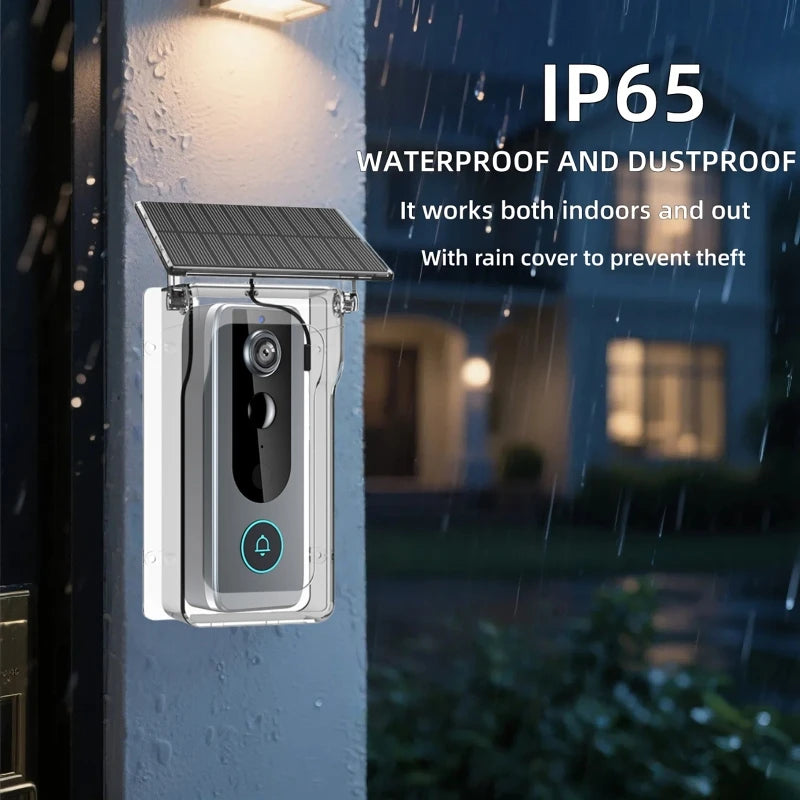 Silver smart video doorbell with a solar panel, protective rain cover, and camera lens, mounted on a wall at night.