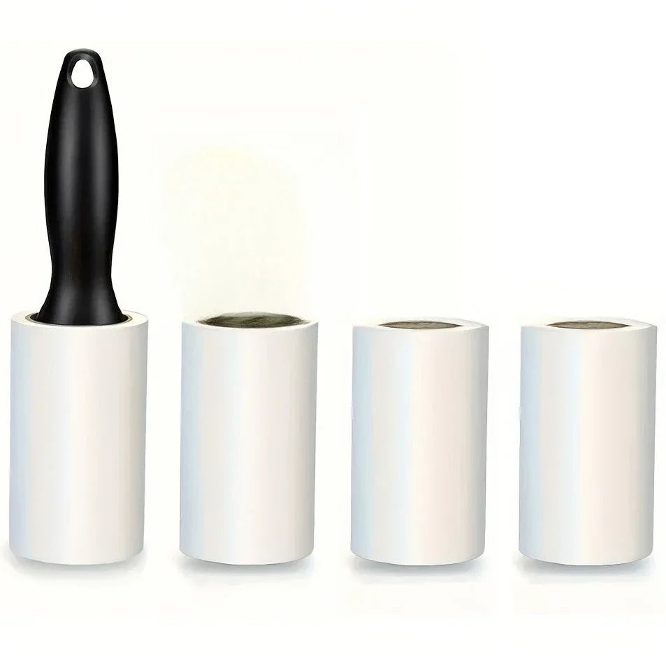 Lint roller with black ergonomic handle and three white adhesive refill rolls against a white background.