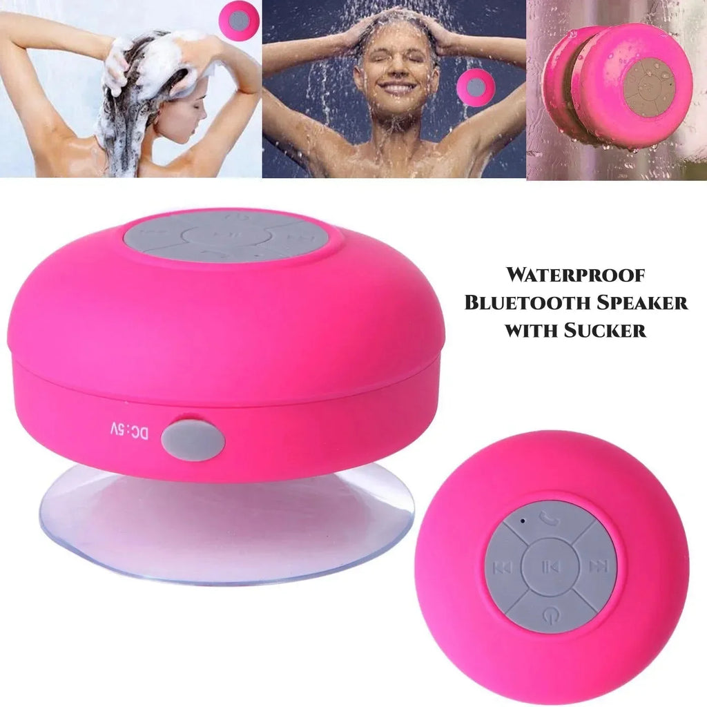 Bright pink, waterproof Bluetooth speaker featuring a grey control panel and a suction cup base for shower use.
