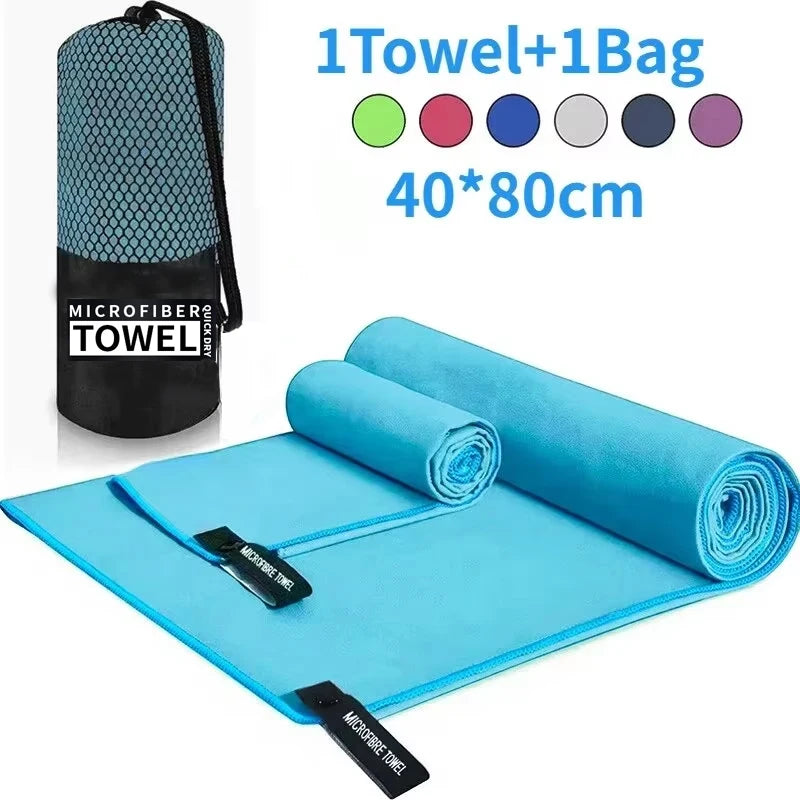 Blue microfibre sports towel in 40x80cm, featuring two rolled towels and a matching mesh carry bag.