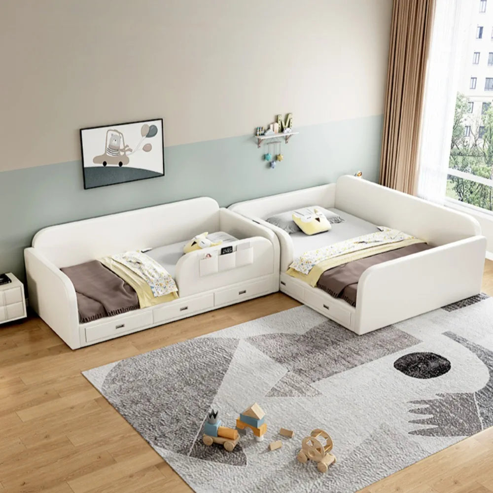 Two modern, white upholstered children's beds with integrated storage drawers in a cosy bedroom setting.