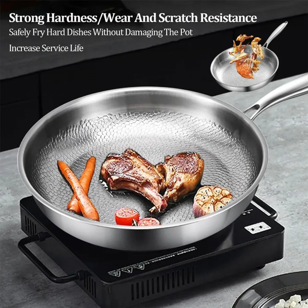 Stainless steel frying pan with a textured honeycomb interior, cooking meat and vegetables on a portable burner.