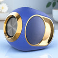 Blue and gold portable waterproof Bluetooth speaker with a modern, rounded design and metallic speaker grille.