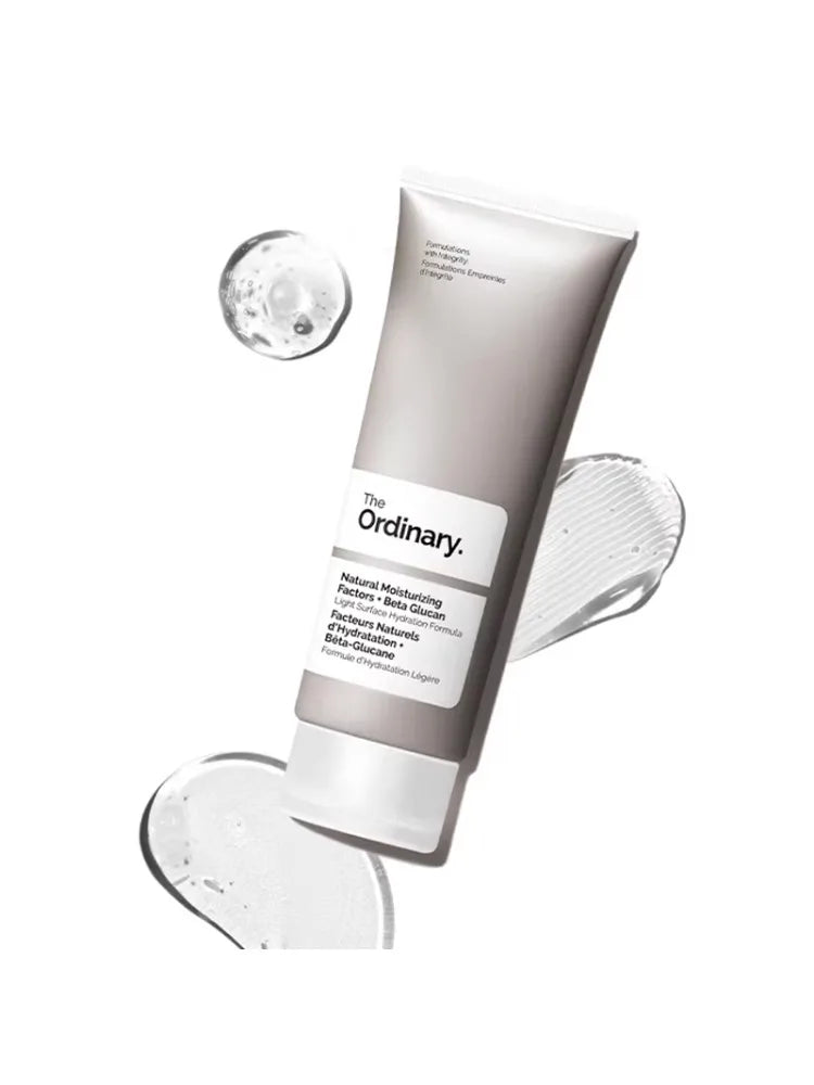 Grey squeeze tube of lightweight moisturizing gel with beta glucan, shown with clear gel droplets on a white background.